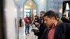 Iranians fill in their ballot papers at a polling station during the parliamentary elections in Tehran, Iran, 21 February 2020.