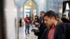 Iranians fill in their ballot papers at a polling station during the parliamentary elections in Tehran, Iran, 21 February 2020.