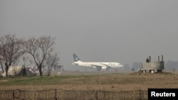 A Pakistan International Airlines (PIA) passenger plane prepares to take off from the Benazir International airport in Islamabad on February 9, 2016.