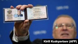 Ultra-conservative politician Vladimir Zhirinovsky, leader of the Liberal Democratic Party of Russia, shows his presidential candidate certificate shortly after receiving it at the Central Election Commission in Moscow, December 29, 2017