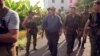 Tengiz Kitovani (center) is seen in the city streets following heavy fighting in Georgia's breakaway region of Abkhazia in 1992.