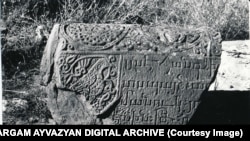 A dove depicted on the fragment of an ancient stone ram in Julfa, photographed in 1915.