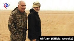 Iranian IRGC member Kheirollah Samadi next to Commander of IRGC Qods force Ghasem Soleimani. Undated Photo published by Al-Alam network.