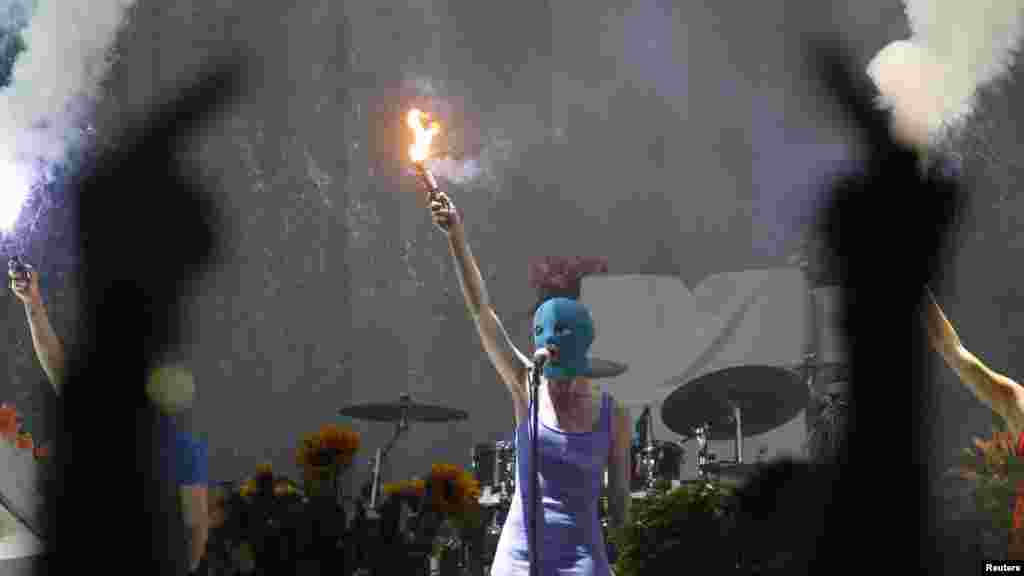 Members of the female punk group Pussy Riot perform during a concert by U.S. rock group Faith No More in Moscow. (Reuters/Sergei Karpukhin)