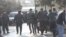 Police arrest two members of the band Bulistan at a youth opposition rally in Baku on March 17.
