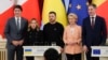 Left to right: Canadian Prime Minister Justin Trudeau, Italian Prime Minister Giorgia Meloni, Ukrainian President Volodymyr Zelenskiy, EU Commission President Ursula von der Leyen, and Belgian Prime Minister Alexander De Croo pose for a photo at Maryinsky Palace in Kyiv on February 24. 