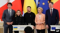 Left to right: Canadian Prime Minister Justin Trudeau, Italian Prime Minister Giorgia Meloni, Ukrainian President Volodymyr Zelenskiy, EU Commission President Ursula von der Leyen, and Belgian Prime Minister Alexander De Croo pose for a photo at Maryinsky Palace in Kyiv on February 24. 