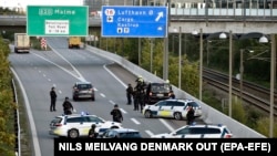 Police vehicles block the street near Copenhagen in September 2018 in an operation, after which Denmark accused Iranian intelligence agencies of planning to assassinate an Iranian activist, believed to be a member of an Arab separatist movement, on Danish soil. 