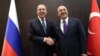 Russian Foreign Minister Sergei Lavrov (left) and Turkish Foreign Minister Mevlut Cavusoglu meet in Antalya on March 29.