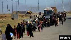 Displaced Iraqis flee their homes during a battle between Iraqi forces and Islamic State militants in western Mosul last month.