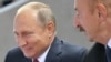 Vladimir Putin (solda) və İlham Əliyev (Arxiv fotosu)
