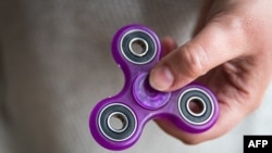 The investigation comes amid concerns in some quarters that fidget spinners make young people vulnerable to "manipulation." (file photo)