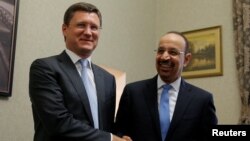 Russia's Aleksandr Novak (left) and Saudi Arabia's Khalid al-Falih shake hands ahead of a meeting in Moscow in May 2017.