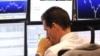 Germany -- A broker looks at his screens at Frankfurt's stock exchange, 15Sep2008