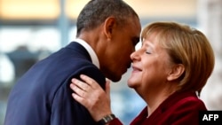 U.S. President Barack Obama is welcomed by German Chancellor Angela Merkel upon his arrival at the chancellery in Berlin on November 17.