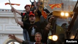 Protesters in Skopje demonstrate in front of the Macedonian parliament against an agreement that would ensure the wider official use of the Albanian language, on March 30.