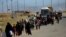Displaced Iraqis flee their homes during a battle between Iraqi forces and Islamic State militants in western Mosul last month.