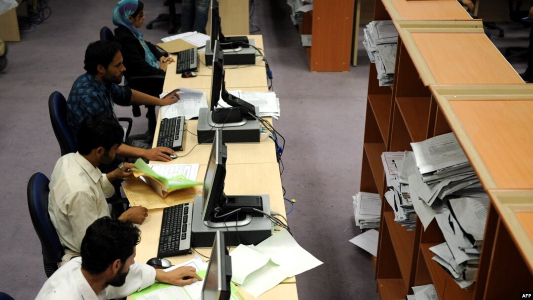 Afghan election workers count results at the Independent Election Commission headquarters in Kabul.