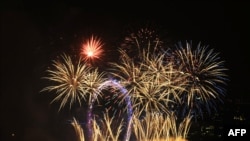 Fireworks are seen over the London Eye to celebrate the start of 2011.