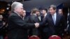 Armenia - Foreign Minister Edward Nalbandian (L) and his Turkish counterpart Ahmet Davutoglu shake hands before the start of a BSEC meeting in Yerevan, 12Dec2013.