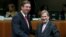 Serbian Prime Minister Aleksandar Vucic (left) posing with European Neighborhood Policy and Enlargement Negotiations Commissioner Johannes Hahn at the start of a European Union-Serbia accession conference in Brussels on December 14.
