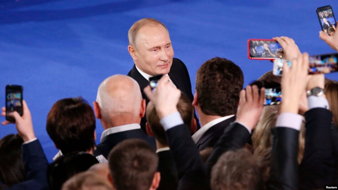 Russian President Vladimir Putin attends a forum of the All-Russia Popular Front in Moscow on December 19.