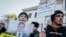 Activists hold a portrait and a placard with the names of Crimean Tatars, who are reportedly missing in Crimea, during a protest in front of the Russian Embassy in Kyiv last week.