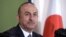 Turkey's Foreign Minister Mevlut Cavusoglu attends a press conference Tuesday, Nov. 6, 2018, in Tokyo. Turkey’s top diplomat has criticized the U.S. resumption of sanctions on Iran as unilateral, not wise and dangerous, calling for a dialogue and compromi