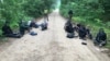 Migrants apprehended by Lithuanian authorities on a forest road near the Belarusian border on July 1.