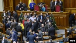 Opposition deputies block the rostrum and presidium of the parliament in Kyiv on January 14. 