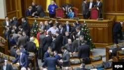 Opposition deputies block the rostrum and presidium of the parliament in Kyiv on January 14. 