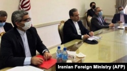 Iranian Deputy Foreign Minister Abbas Araqchi (center) attends a virtual meeting with the Joint Commission on Iran's nuclear program in Tehran on April 2.