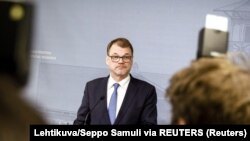 Премьер-министр Финляндии Юха Сипиля во время пресс-конференции 8 марта 2019 года