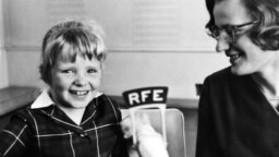 Germany--Olga Kopecka (Valeska) of RFE's Czechoslovak Service (right) and young guest Zdenka Sudova at RFE Headquarters in Munich in 1965.