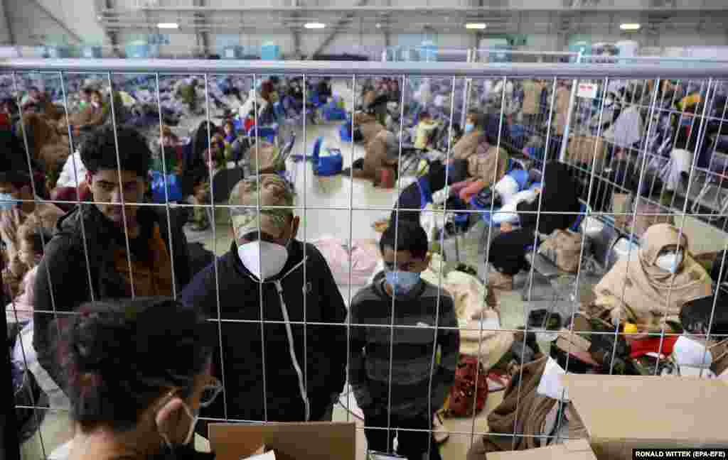 Evacuees from Afghanistan wait in a holding area for flights to the United States at the U.S. air base in Ramstein.