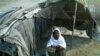 Zar Sanga sits outside her shelter in Pakistan's Khyber Pakhtunkhwa Province