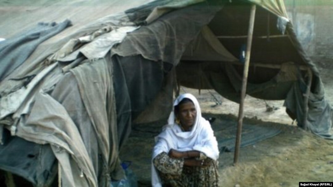 Zar Sanga sits outside her shelter in Pakistan's Khyber Pakhtunkhwa Province