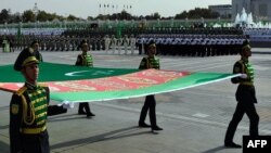 Turkmen servicemen march during a military parade marking the 25th anniversary of Turkmenistan's independence, in Ashgabat on October 27.