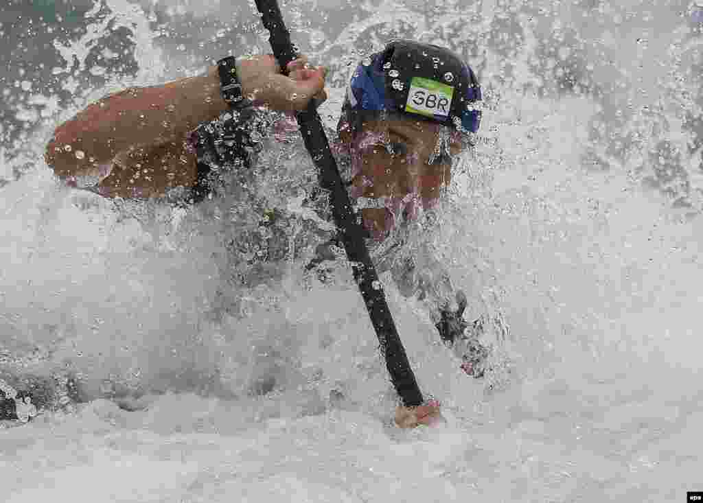 Joseph Clarke of Great Britain wins gold in the men's K1 kayak event.