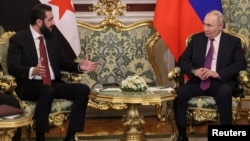 Ахмед аш-Шараа и Владимир Путин на встрече в Кремле, октябрь 2025 года