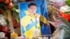 KAZAKHSTAN - Candles, flowers, and photos of the assassinated Kazakhstan's Olympic figure skater Denis Ten are seen at the makeshift memorial in Almaty, Kazakhstan July 20, 2018