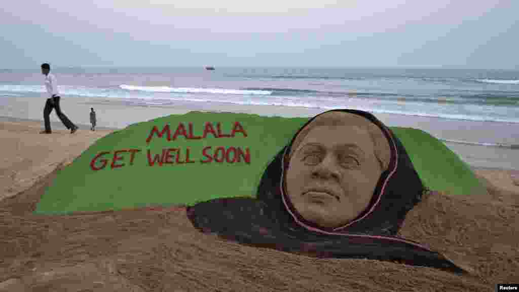 OCTOBER 16, 2012 -- A man walks next to a sand sculpture of Pakistani schoolgirl Malala Yousafzai created by sand artist Sudarshan Patnaik on a beach in Puri in the eastern Indian state of Odisha. Yousafzai was shot in the head by the Taliban for advocating education for girls. British doctors treating her say she has every chance of making a &quot;good recovery.&quot; (Reuters)