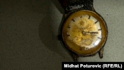 A donated watch on a shelf in Memorial Center Potočari, Srebrenica