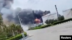 Smoke billows from a fire at an Iranian oil refinery in Lavan, Hormozgan Province, on April 8.