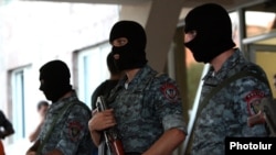 Armenia - Armed police officers guard the entrance to a hospital in Yerevan where opposition gunmen wounded by secrity forces are receiving medical aid, 29Jul2016.