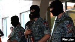 Armenia - Armed police officers guard the entrance to a hospital in Yerevan where opposition gunmen wounded by secrity forces are receiving medical aid, 29Jul2016.