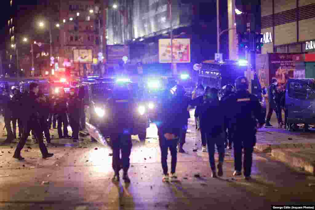 Some protesters threw firecrackers at the police in Bucharest.