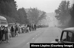 Protesters begin to gather along the route.