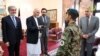 FILE: Afghan President Ashraf Ghani (2 - L) granting an Afghan Army soldier, Esa Khan (C) with the keys to a new flat in recognition of his bravery in June 2015.