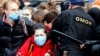 BELARUS -- Riot police officers detain students as they take part in a nationwide strike in Minsk, October 26, 2020